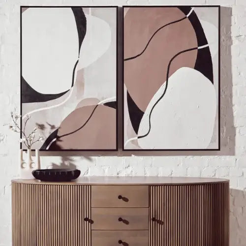 set-of-two-abstract-chocolate-brown-black-and-white-artwork-in-black-pine-wood-frames-above-large-sideboard-in-living-area-at-albury-house-interiors