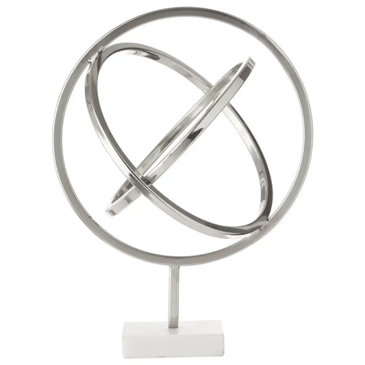 chrome-siver-spiral-round-sculpture-on-marble-base-at-albury-house-interiors