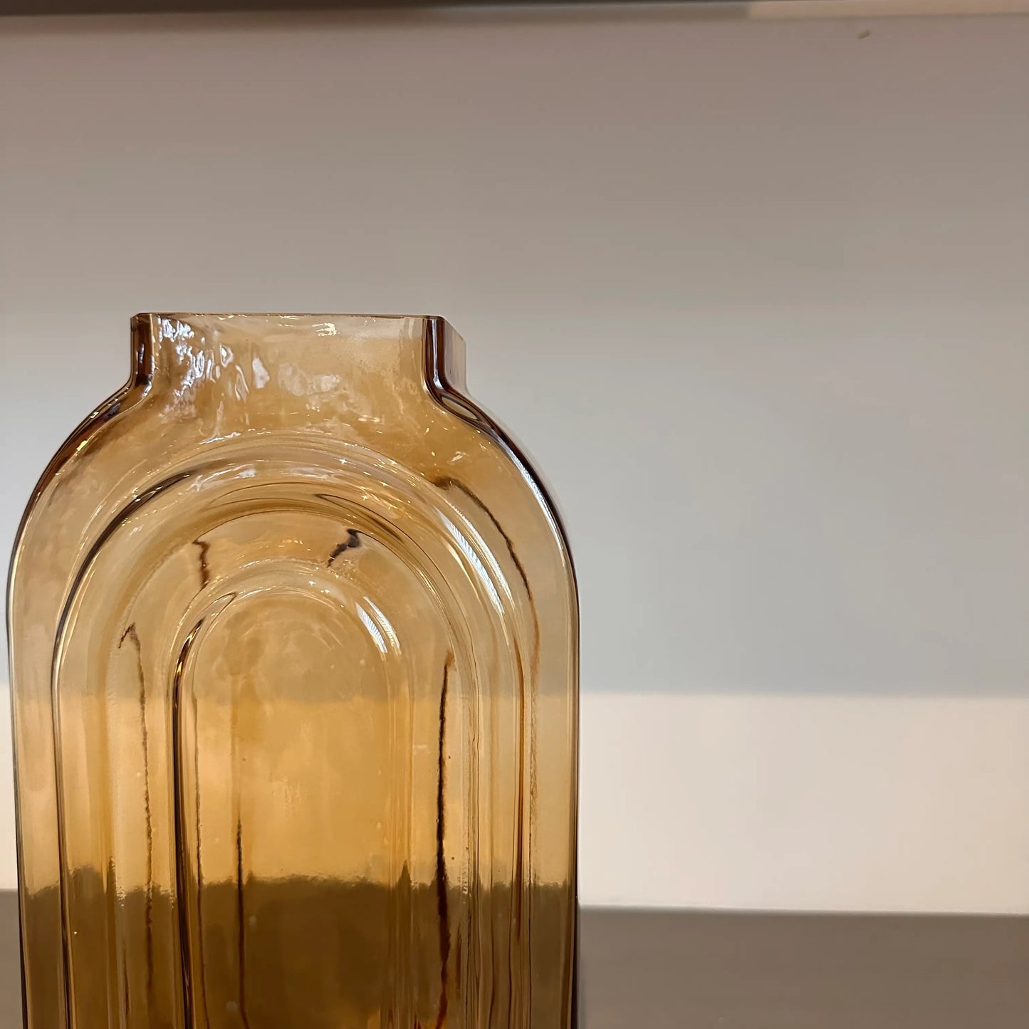 retro-look-oval-glass-vase-in-dark-orange-amber-tone-at-albury-house-interiors-essex