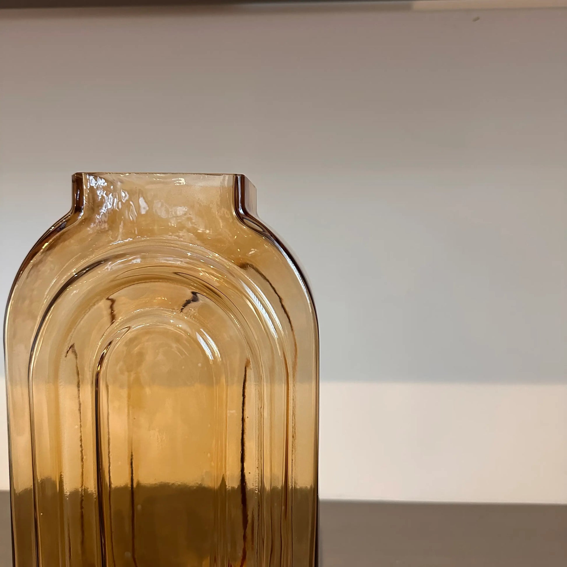 retro-look-oval-glass-vase-in-dark-orange-amber-tone-at-albury-house-interiors-essex