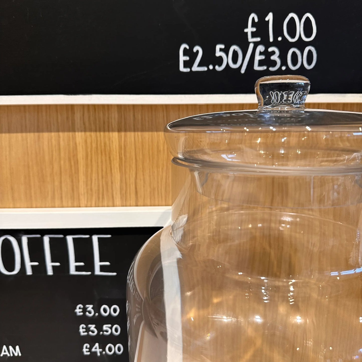 closeup-of-extra-large-lidded-clear-glass-ginger-jar-at-albury-house-interiors-and-coffeeshop-essex