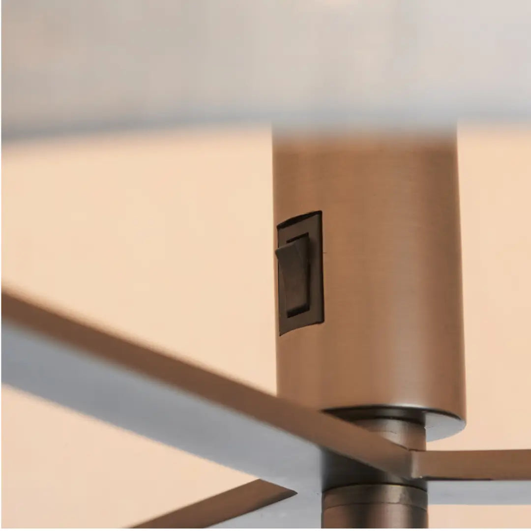 Minnesota floor lamp with dark brushed bronze base and metalwork, finished with a beautiful natural linen lampshade, available in small and large at Albury House Interiors. 