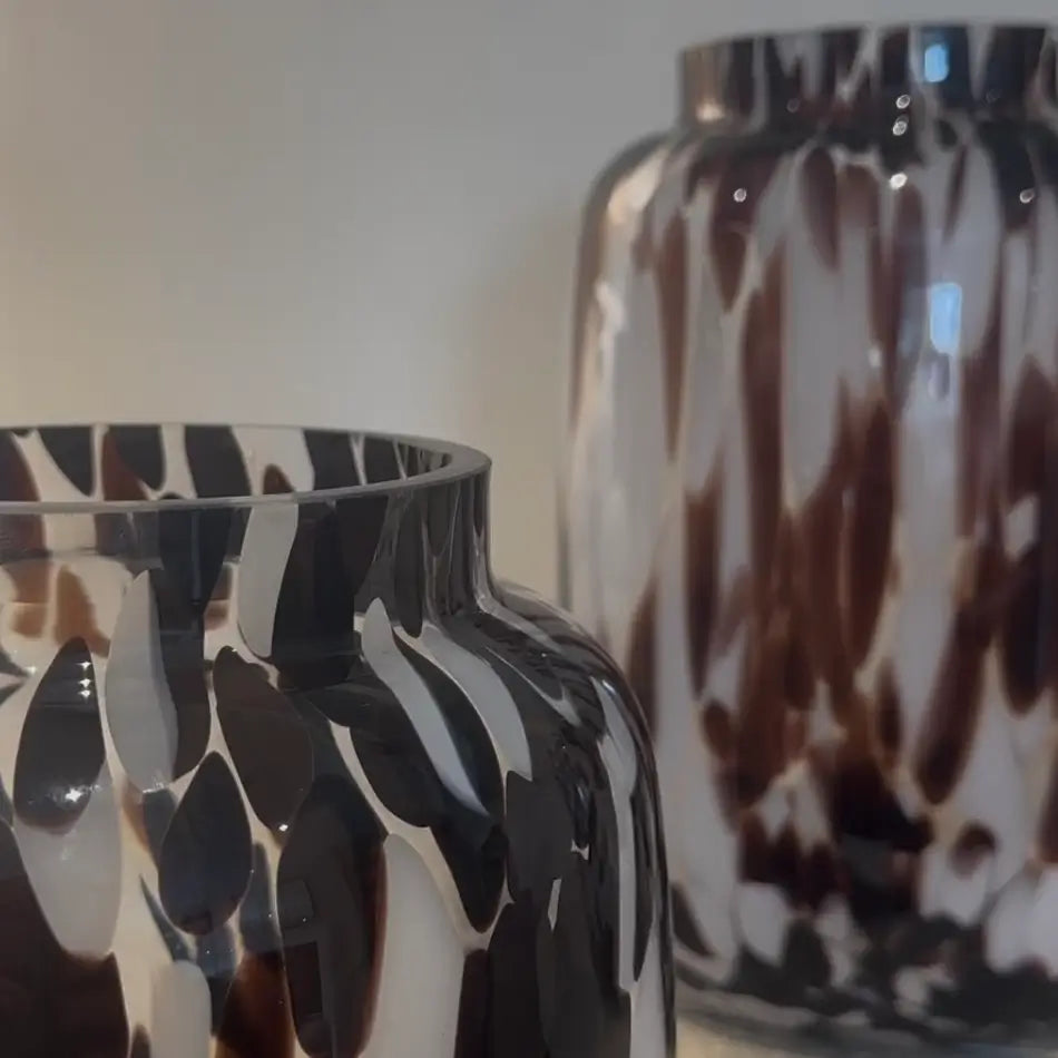 Hand blown brown and white glass oval curved shape vases with mottled, speckled patterns across the entire body, making each one completely unique. Shop these vases online or in store at Albury House Interiors. 