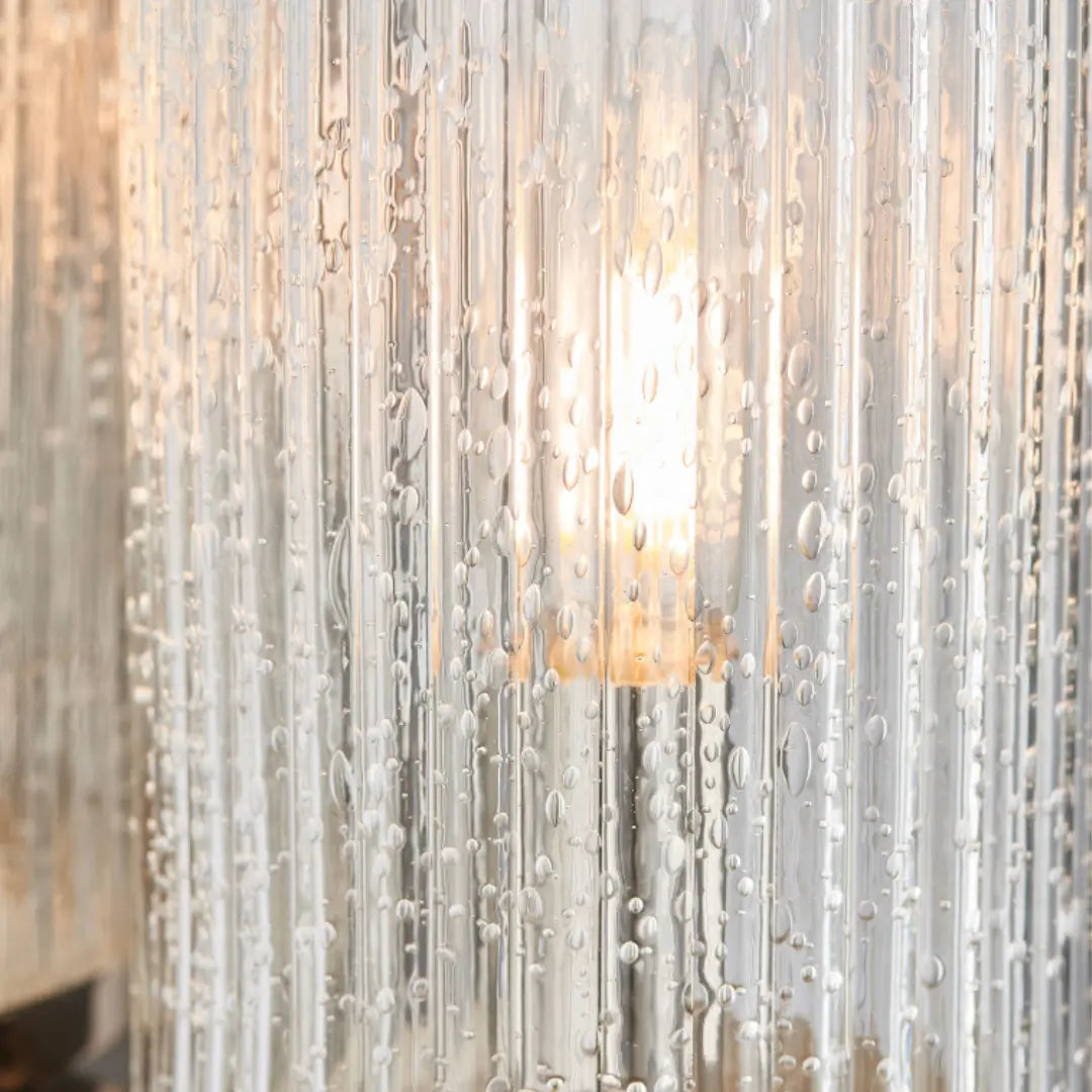 Bright nickel plated wall light, featuring  ribbed glass with a bubble effect throughout - creating a beautiful diffused light. Available to purchase from Albury House Interiors, homewares in the UK.