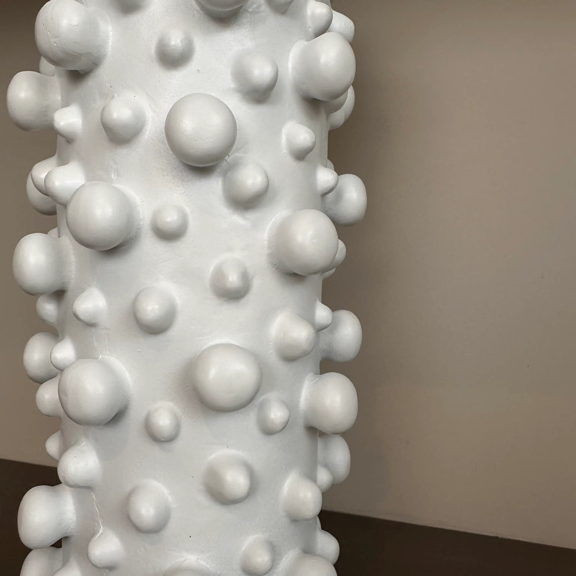 closeup-shot-of-tall-white-polyresin-vase-with-small-and-large-bubbles-at-albury-house-interiors