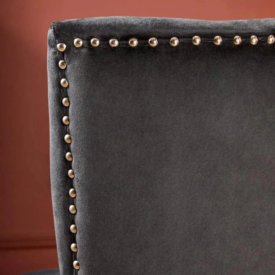 Cologne black soft velvet occasional chair with matching black wooden square legs and silver studded detail around front and back edges. Available at Albury House Interiors
