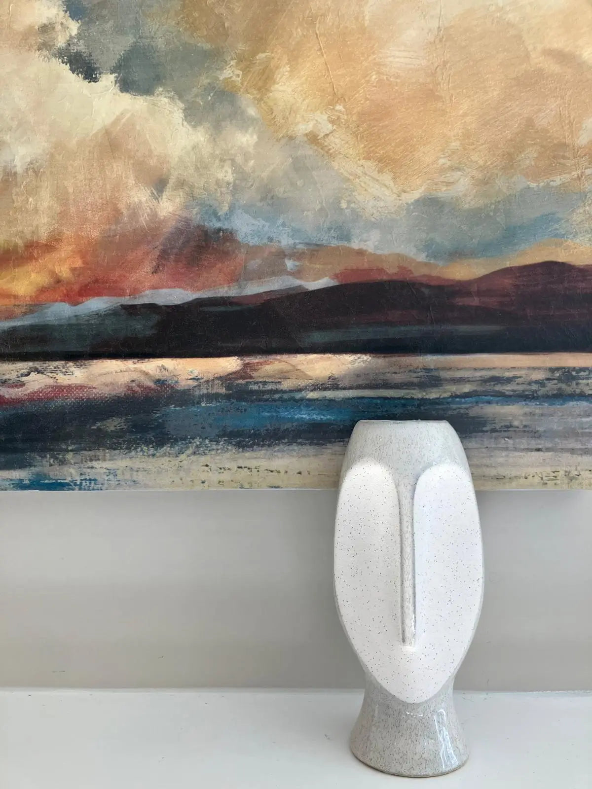 cream-textured-bali-face-vase-with-multi-coloured-sunset-artwork-canvas-at-albury-house-interiors