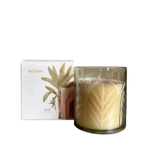Medina candle in an engraved glass jar with decorative palm tree design, our scented, gift boxed in a white box with a monkey on the front. Available to purchase at Albury House Interiors, Essex. 