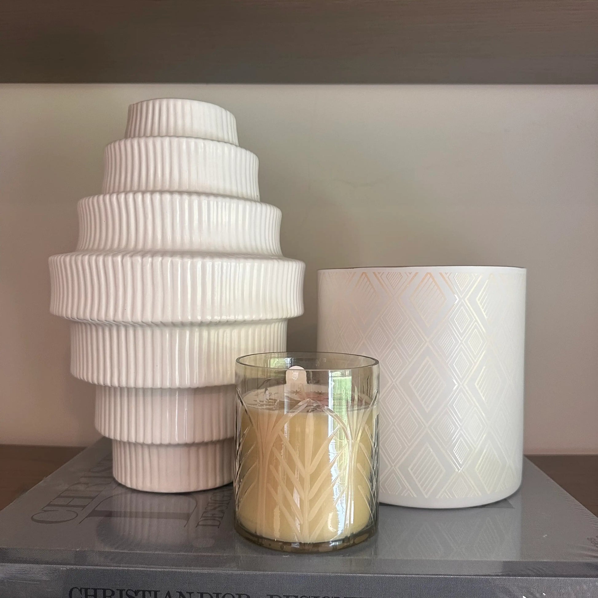 Medina candle in an engraved glass jar with decorative palm tree design, our scented, gift boxed in a white box with a monkey on the front. Available to purchase at Albury House Interiors, Essex. 