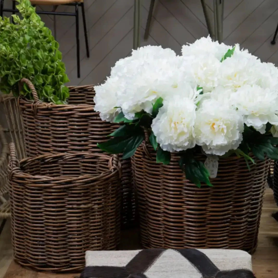 Dark natural woven rattan basket set of three in various sizes, available to purchase from Albury House Interiors.