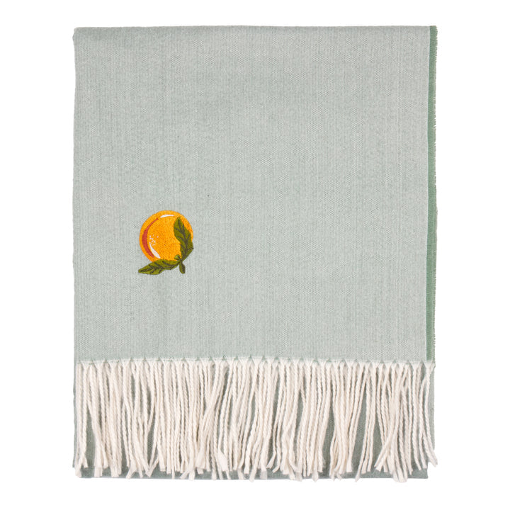 Lightweight pale blue throw blanket with white fringe and embroidered orange design available at Albury House Interiors