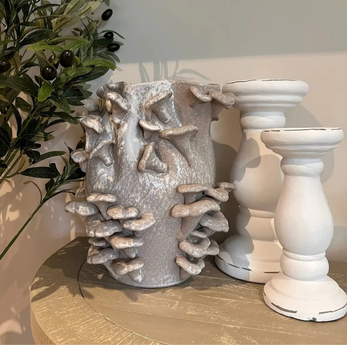 ceramic-fungi-mnushroom-vase-with-white-heavy-pillar-candle-holders-at-albury-house-interiors