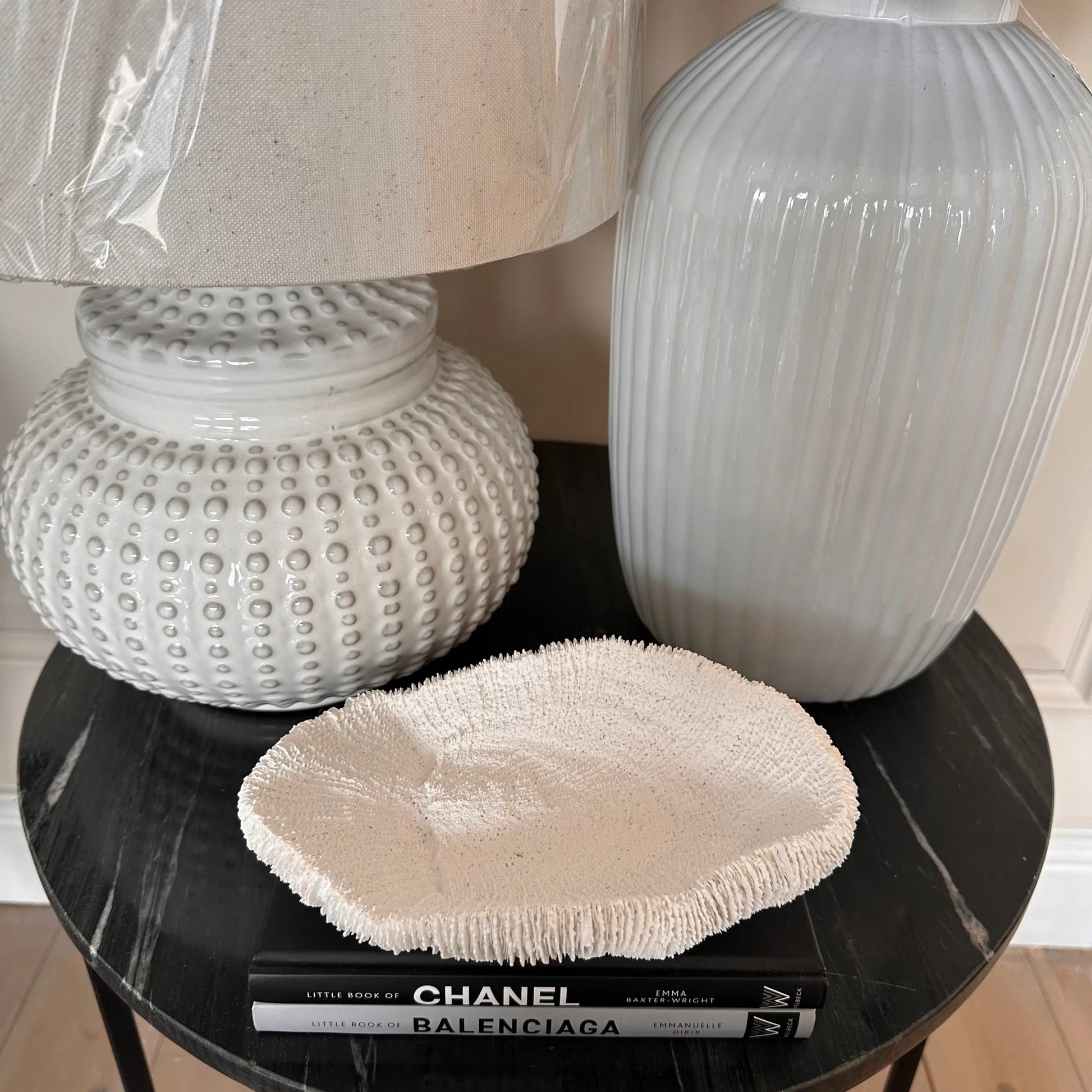 white-squat-dimple-lamp-with-white-faux-fungia-coral-bowl-ornament-at-albury-house-interiors-coffee-shop-essex