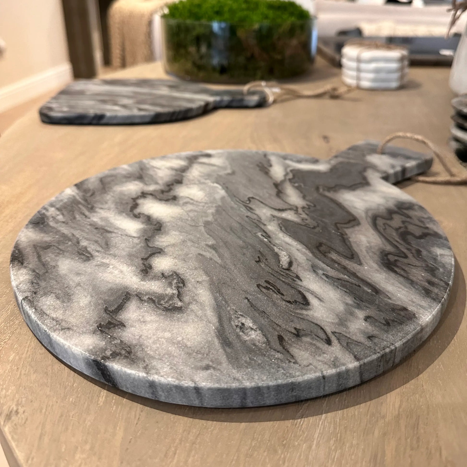 light-grey-amd-dark-grey-natural-marble-stone-paddle-chopping-serving-board-with-string-for-hanging-at-albury-house-interiors-essex