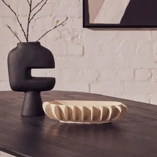 harlem-cream-aluminium-oval-shaped-bowl-with-outer-detailing-on-dark-wood-dining-table-at-albury-house-interiors