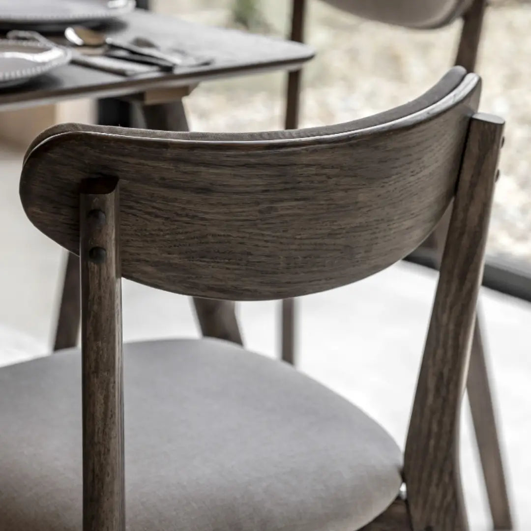 Haze dark wooden veneer dining chairs with linen cushioned seat and back rest. Available to purchase at Albury House Interiors. 