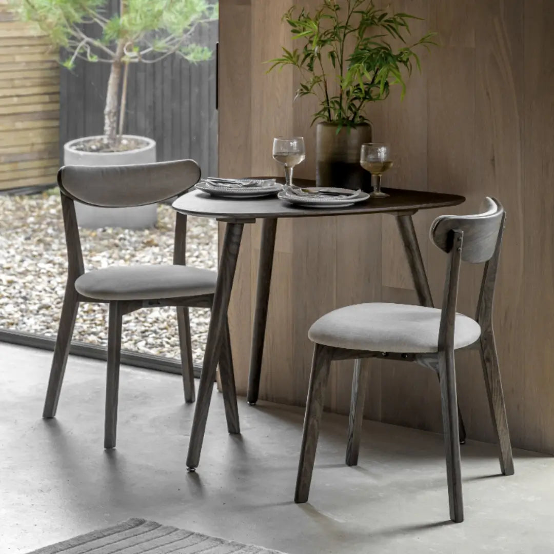 Haze dark stained veneer two seater dining table, with matching upholstered dining chairs. Available at Albury House Interiors.