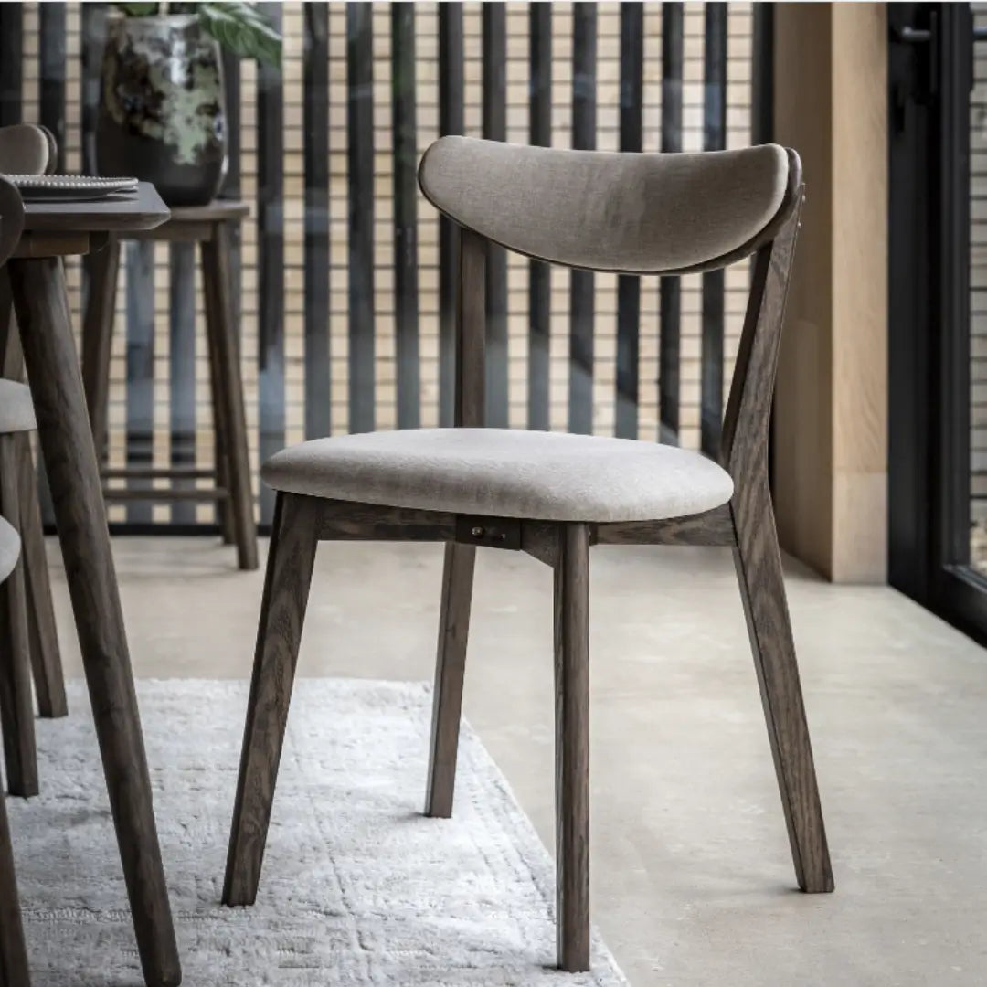 Haze dark wooden veneer dining chairs with linen cushioned seat and back rest. Available to purchase at Albury House Interiors. 