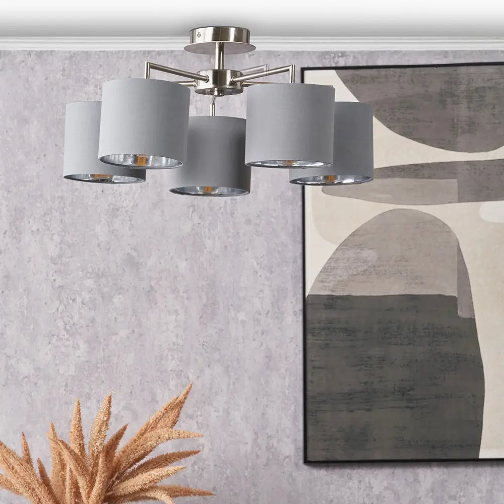 kenny-5-arm-brushed-silver-ceiling-light-with-grey-shades-and-metallic-silver-lining-in-living-room-at-albury-house-interiors