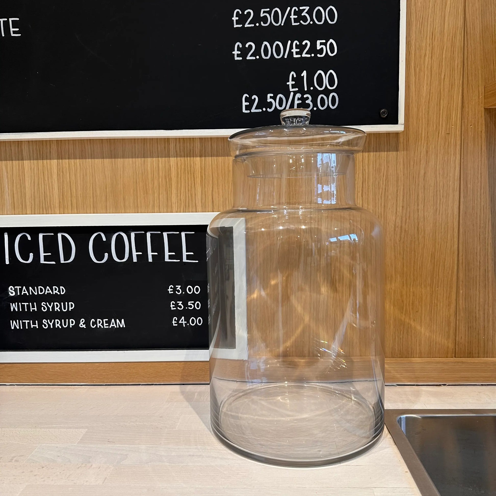 extra-large-lidded-clear-glass-ginger-jar-on-worktop-in-kitchen-at-albury-house-interiors-and-coffeeshop-essex