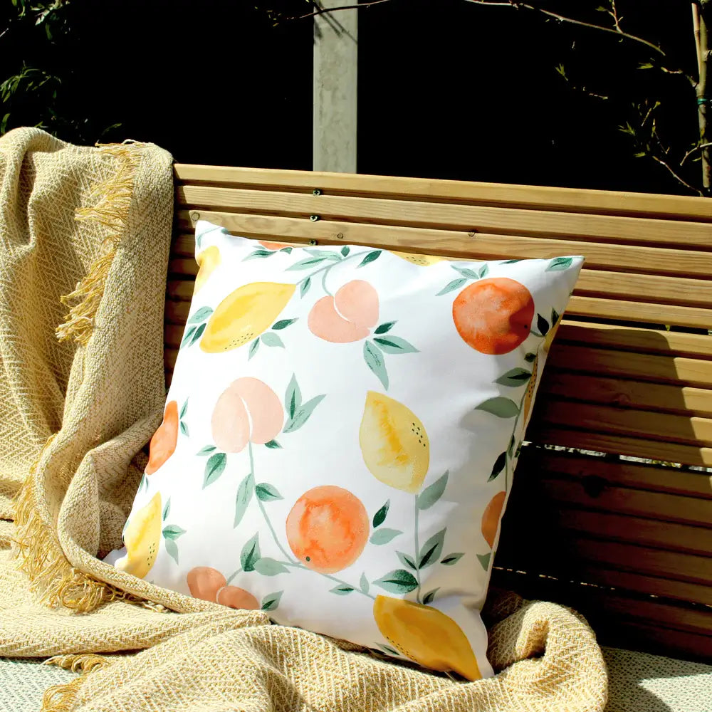 citrus-fruits-lemons-oranges-peaches-outdoor-cushion-in-pastel-colours-and-white-at-albury-house-interiors 