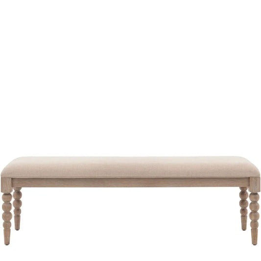 lime-washed-oak-dining-bench-bobbin-round-detailed-legs-with-biscuit-neutral-fabric-upholstery-at-albury-house-interiors-giftware-and-homeware-shop-in-essex