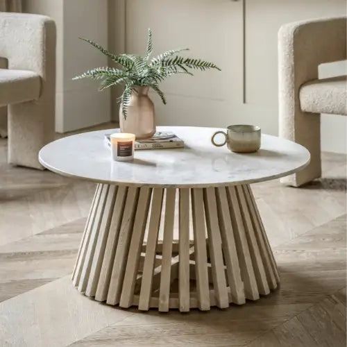 Mayfair round coffee table crafted from whitewashed mango wood and sand blasted for effect, complete with natural white veined marble top. This range is available to purchase from Albury House Interiors, Essex. 