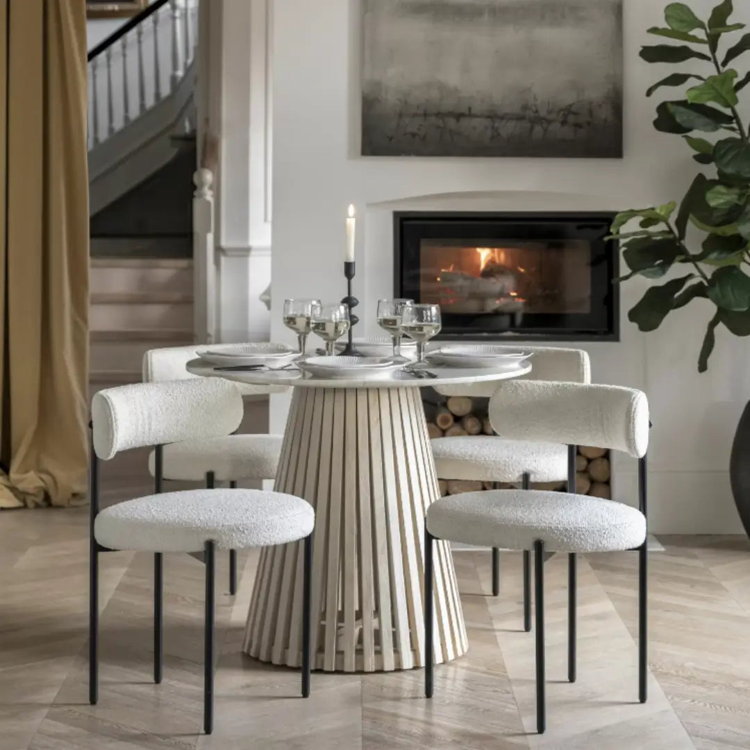 Mayfair circle shaped dining table with natural white veined marble top and whitewashed mango wood base, sandblasted for effect. Paired beautifully with our Ava boucle dining chairs in vanilla colour with mat black frames. Whole range available to purchase from Albury House Interiors. 