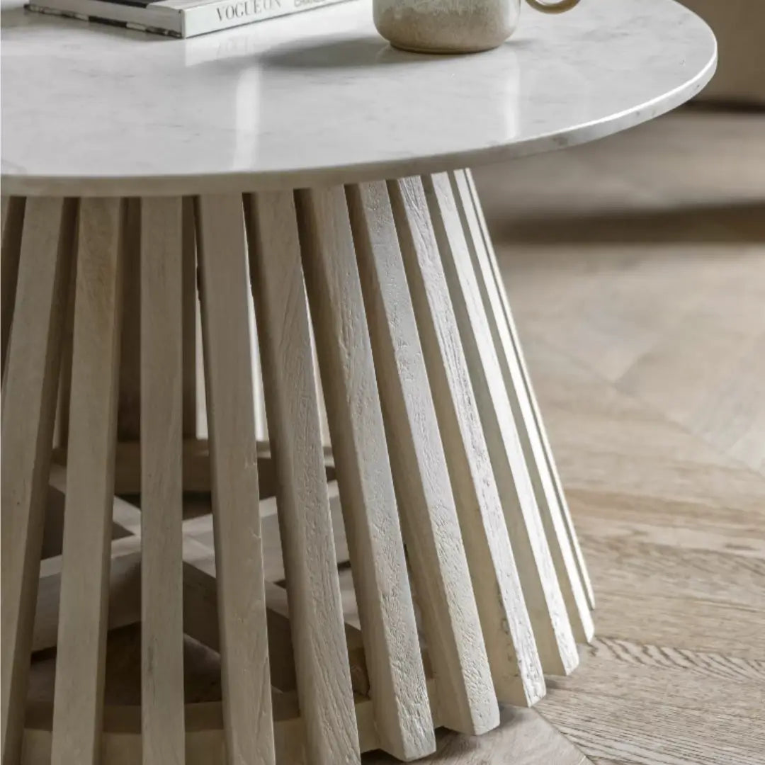 Mayfair round coffee table crafted from whitewashed mango wood and sand blasted for effect, complete with natural white veined marble top. This range is available to purchase from Albury House Interiors, Essex. 