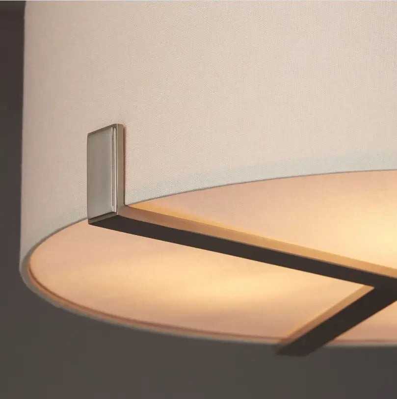 Minnesota round ceiling light with a brushed nickel finish, featuring three lightbulbs and a neutral-colored linen-effect lampshade. Available for purchase at Albury House Interiors.