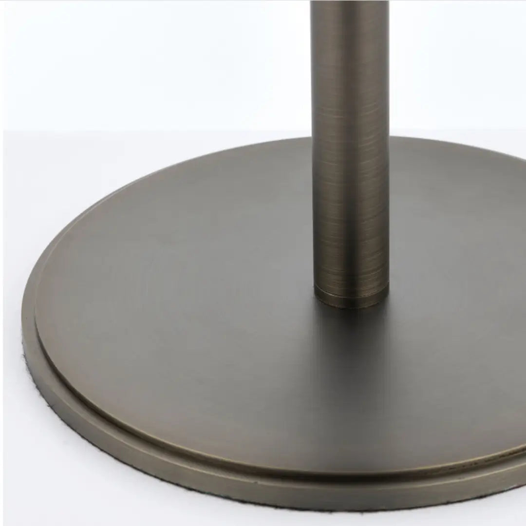 Minnesota table lamp with dark brushed brass base and metal features, and round natural linen lampshade. Available to purchase at Albury House Interiors, luxury homewares in the UK.