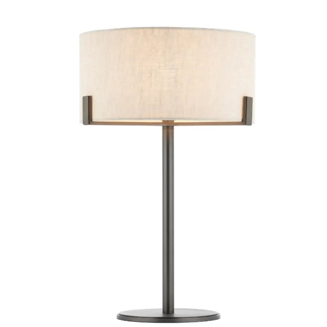 Minnesota table lamp with dark brushed brass base and metal features, and round natural linen lampshade. Available to purchase at Albury House Interiors, luxury homewares in the UK.