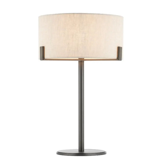 Minnesota table lamp with dark brushed brass base and metal features, and round natural linen lampshade. Available to purchase at Albury House Interiors, luxury homewares in the UK.