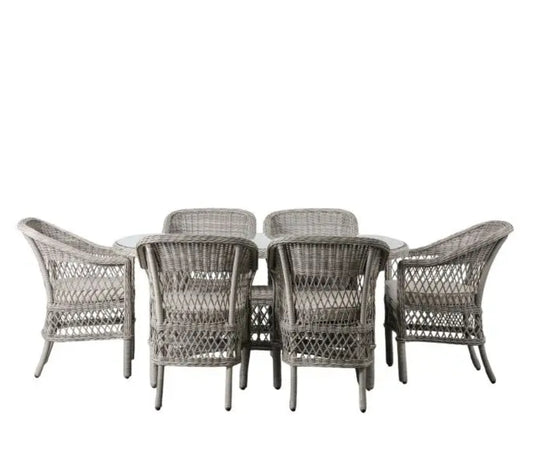 Moreton stone grey colour rattan outdoor furniture, 6 chairs and a glass topped oval dining table with showerproof seat and back cushions, available at Albury House Interiors