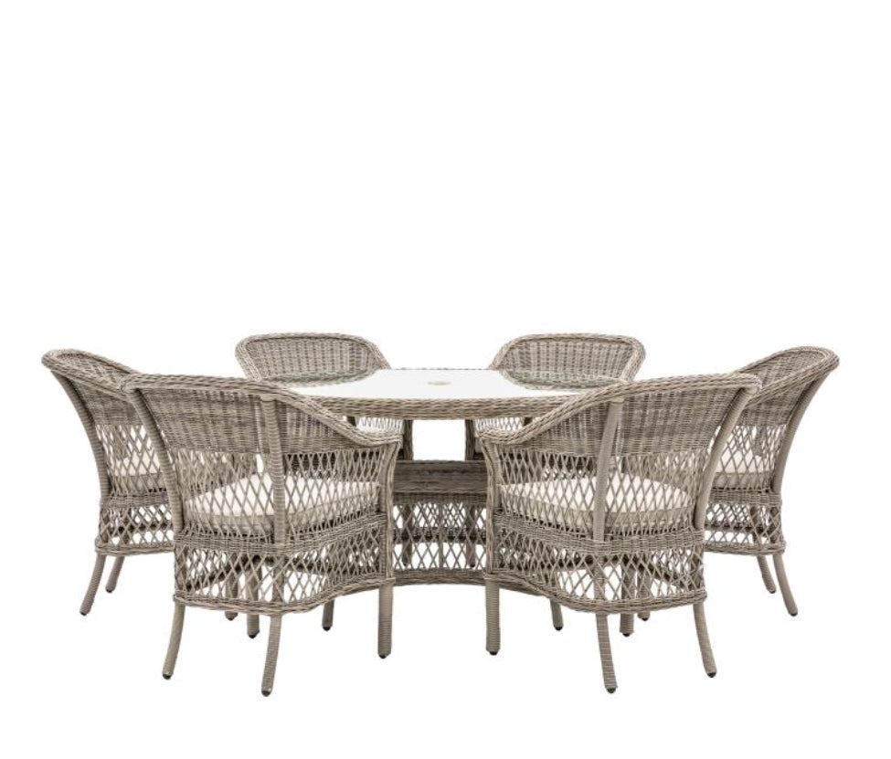 Moreton stone grey colour rattan outdoor furniture, 6 chairs and a glass topped round dining table with showerproof seat and back cushions, available at Albury House Interiors