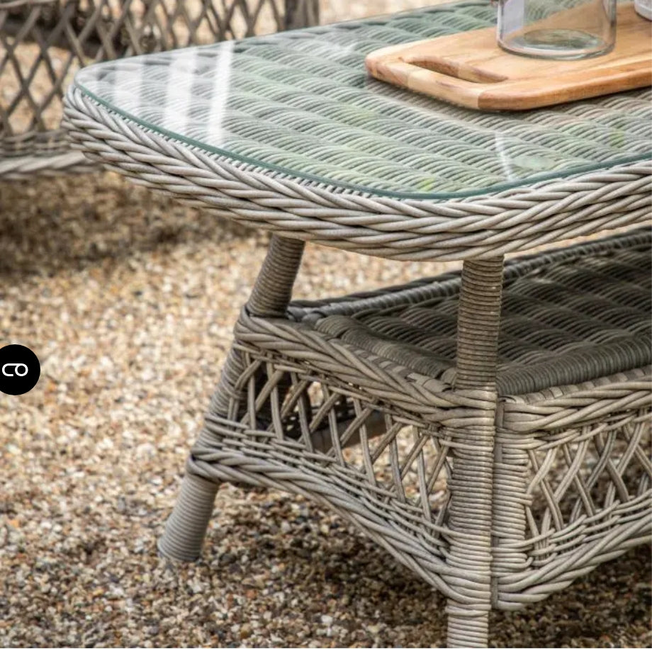 Moreton Chaise set, all weather, stone coloured rattan chaise sofa with matching weather proof cushions. Pretty open weave rattan glass topped table, available at Albury House Interiors.