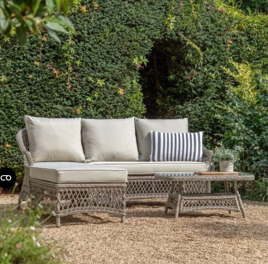 Moreton Chaise set, all weather, stone coloured rattan chaise sofa with matching weather proof cushions. Pretty open weave rattan glass topped table, available at Albury House Interiors.