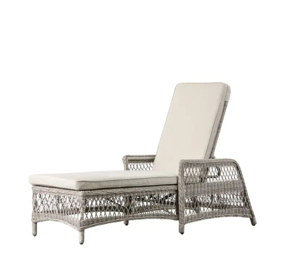 Moreton reclining, all weather, stone coloured rattan lounger with matching weather proof cushions. Pretty open weave rattan, available at Albury House Interiors.