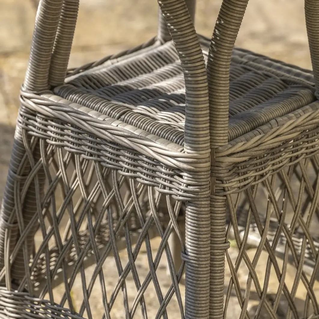 Moreton rattan woven outdoor bistro set with two armchair style seats with natural coloured weatherproof cushions and round rattan glass top table. Available to purchase at Albury House Interiors.