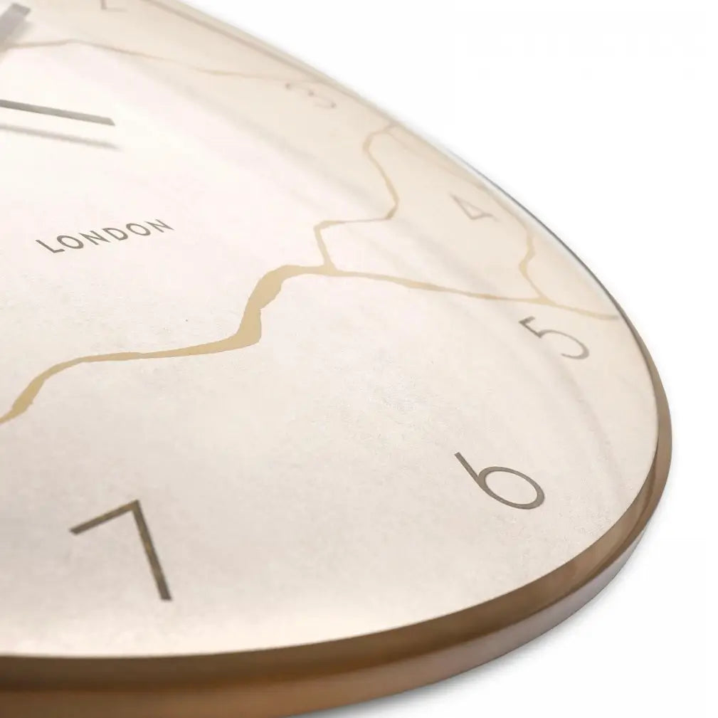 Naples round wall clock crafted by Thomas Kent, inspired by Japanese Kintsugi of fixing ceramics that have been broken. A faux stone clock face with gold veined detailing with matching hands and rim. Available to purchase at Albury House Interiors Essex.
