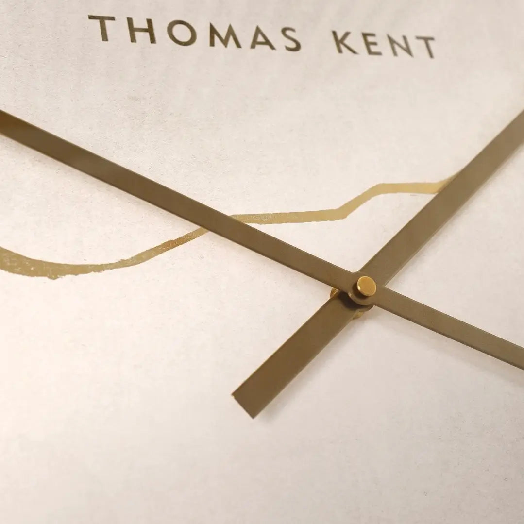 Naples round wall clock crafted by Thomas Kent, inspired by Japanese Kintsugi of fixing ceramics that have been broken. A faux stone clock face with gold veined detailing with matching hands and rim. Available to purchase at Albury House Interiors Essex.