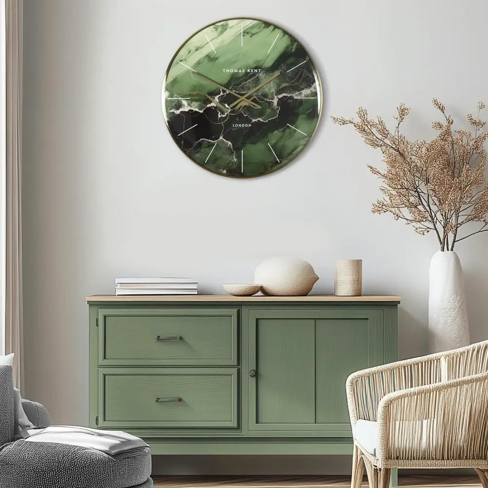 Naples round wall clock with emerald green, white and gold swirls throughout creating a marble effect. Finished with a glass domed front and gold rim with matching hands. Available to purchase at Albury House Interiors. 