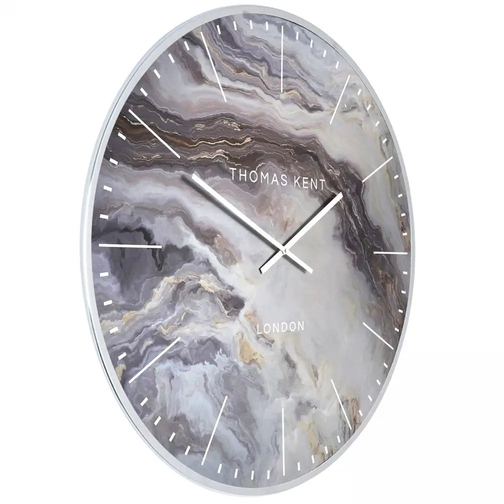 Naples round wall clock inspired by mother of pearl, featuring white, silver, bronze and steel blue swirls giving a marble effect. Finished with a chrome silver rim and matching clock hands, available to purchase at Albury House Interiors.