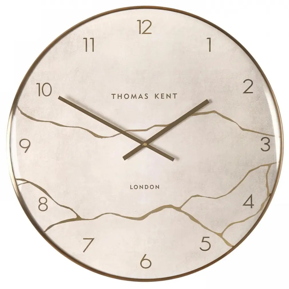 Naples round wall clock crafted by Thomas Kent, inspired by Japanese Kintsugi of fixing ceramics that have been broken. A faux stone clock face with gold veined detailing with matching hands and rim. Available to purchase at Albury House Interiors Essex.