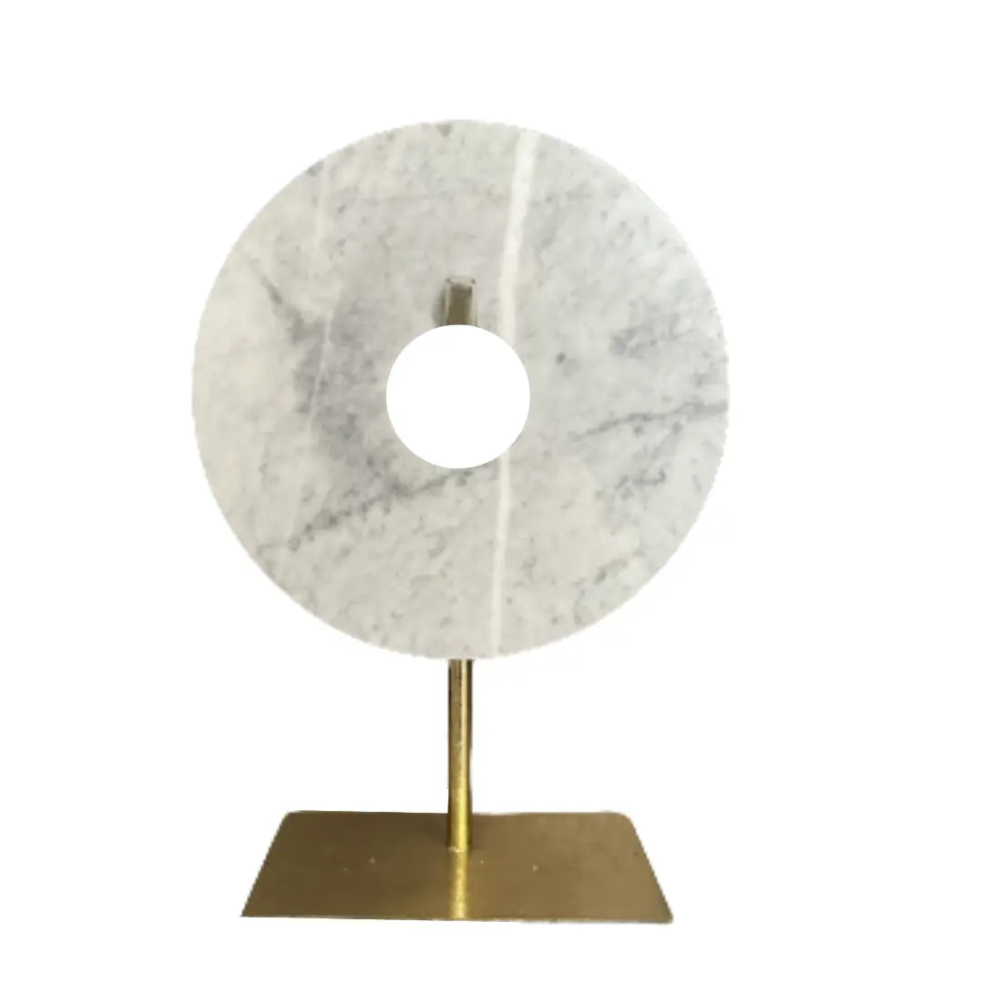 Round marble white and grey disc placed on gold stand, as used by interior designers. Available to purchase from Albury House Interiors, interior accessories in Essex and London. 