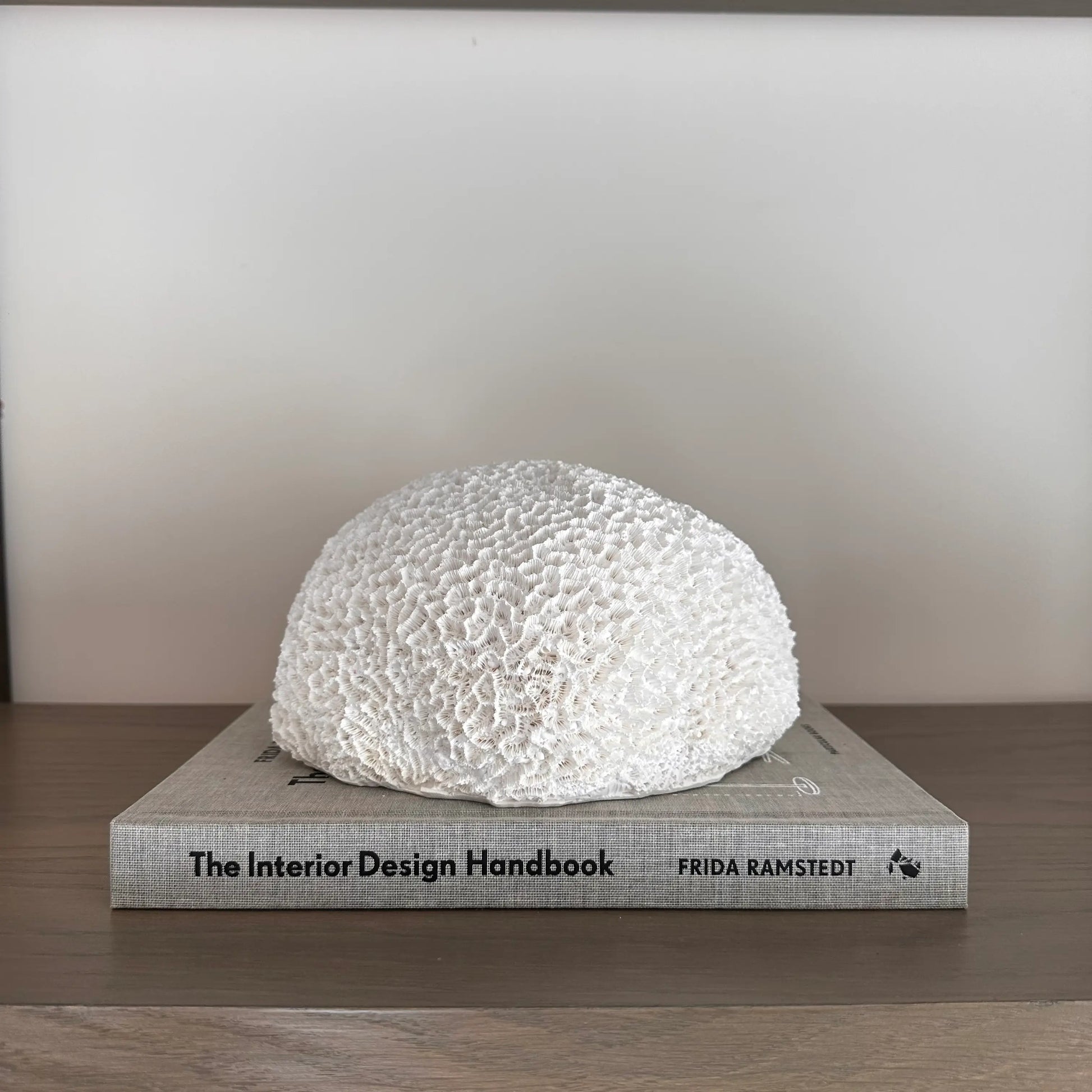 textured-nerina-faux-coral-on-top-of-interior-design-handbook-coffee-table-book-at-albury-house-interiors