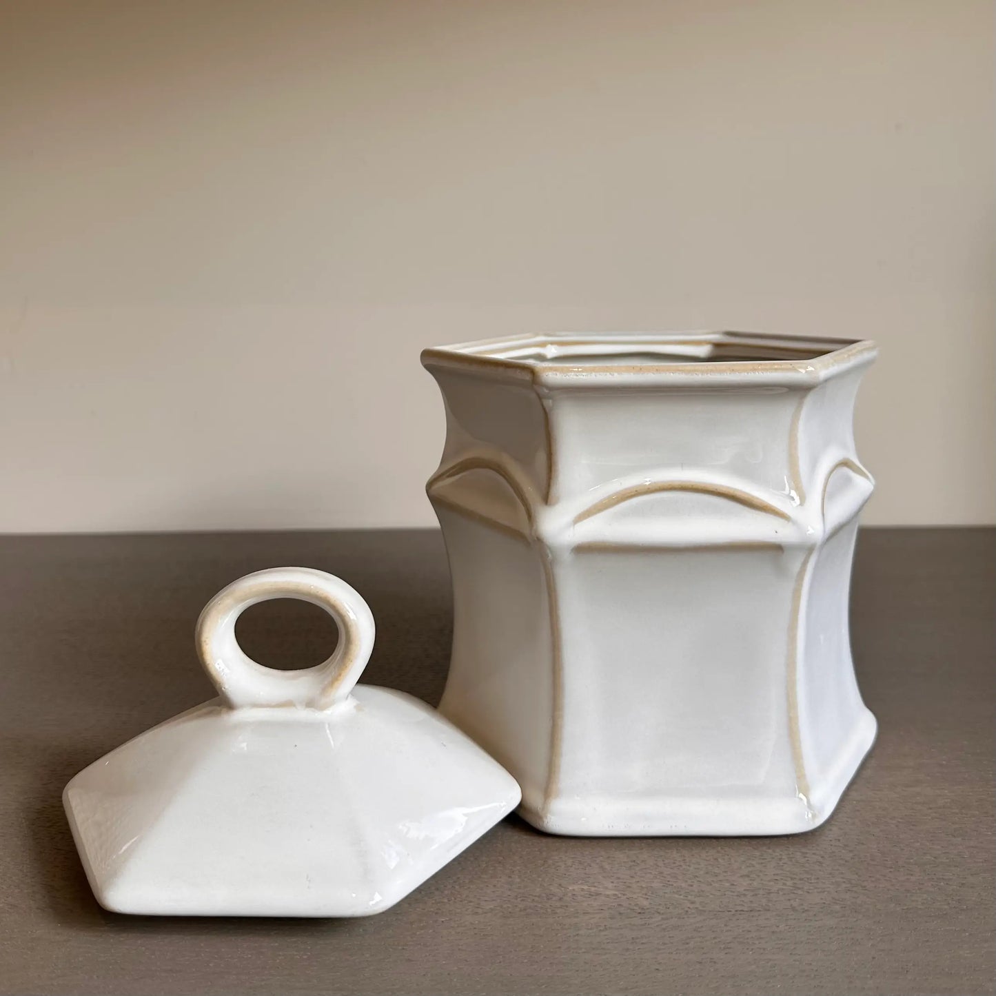 Crafted from neutral coloured ceramic with rustic details, this small jar comes complete with a lid and is perfect for storing all sorts of things in your home. Available to purchase at Albury House Interiors.