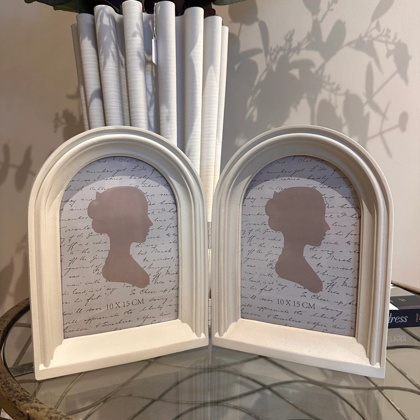 neutral-coloured-double-arched-curved-photo-frame-in-living-room-at-albury-house-interiors-essex