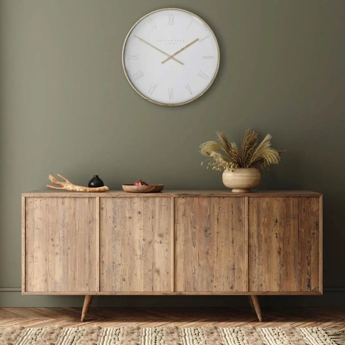 Norway round wall clock with white face and matching outer rim, and wooden effect hands and front edge. Available to purchase at Albury House Interiors, homewares shop in Essex.