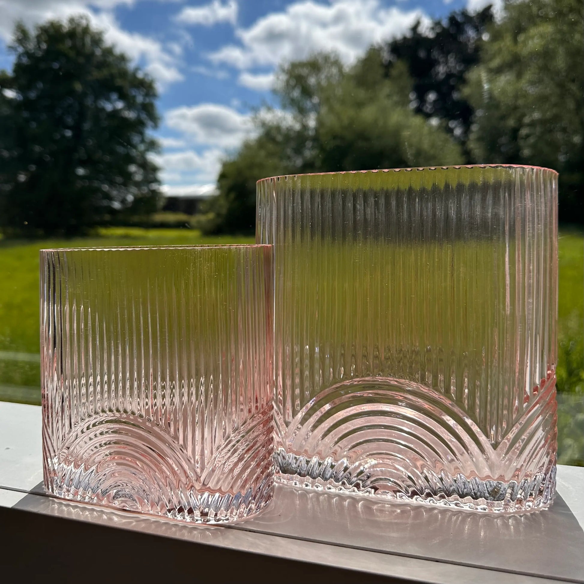 pair-of-pink-ribbed-glass-vases-at-albury-house-interiors